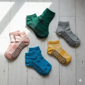 A collection of various pilates grippy socks styles, including toeless, full-toe, and ankle-height designs, showing different colors.