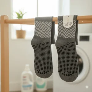 A graphic representation or close-up of the durable grip dots after multiple washes, emphasizing that the pilates grippy socks are machine washable.