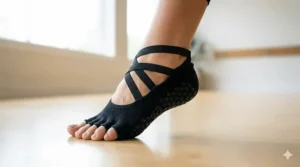 Stylish ballet-inspired barre socks with elastic criss-cross straps for a secure fit during floor work.
