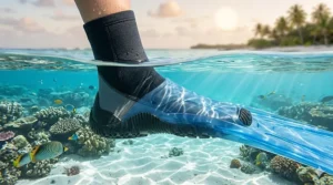 An illustration of a swimmer wearing protective water sports socks inside snorkeling fins to prevent chafing.